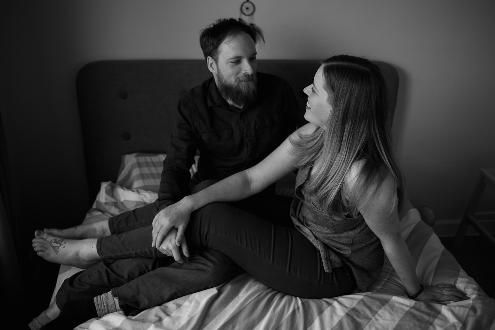 black and white photograph of couple relaxing during couple photos