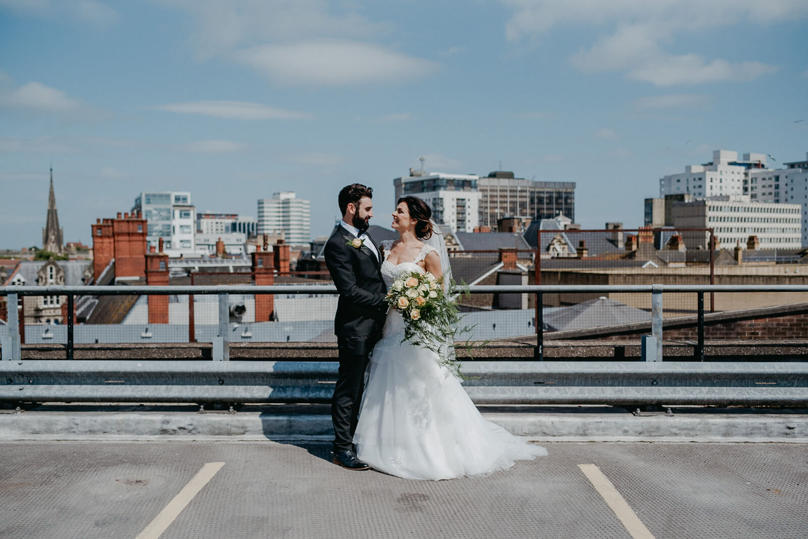 adventerous alternative bride and groom on rooftop for portraits in city...new york wedding photographer