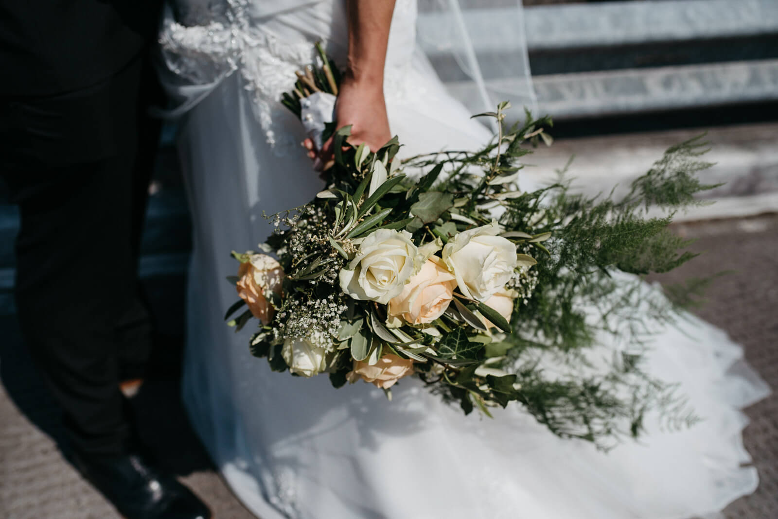 brides flowers during coupleshoot on rooftop reminiscent of new york