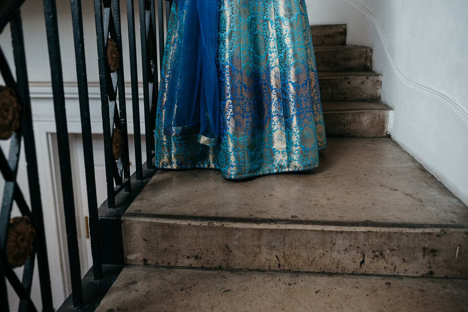 beautiful indian dress on concrete stairs at Marylebone One, London