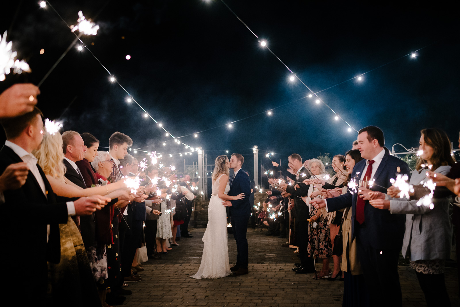 Relaxed Bride & Groom dance under festoon lighting at their Glove Factory Studio Wedding