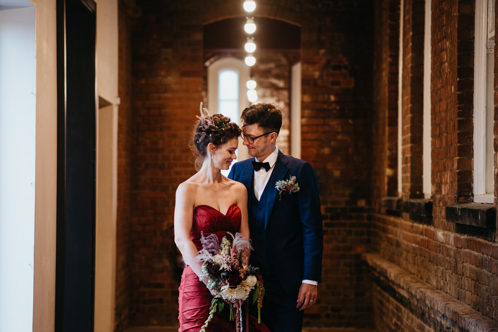 bride and groom laugh during their couple portraits in Battersea Arts Centre