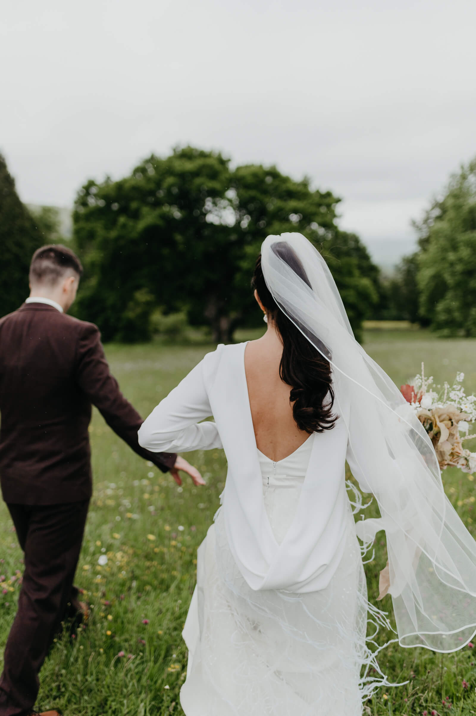 Plas Dinam bride shows off the beautiful details of her Kate Halfpenny London dress