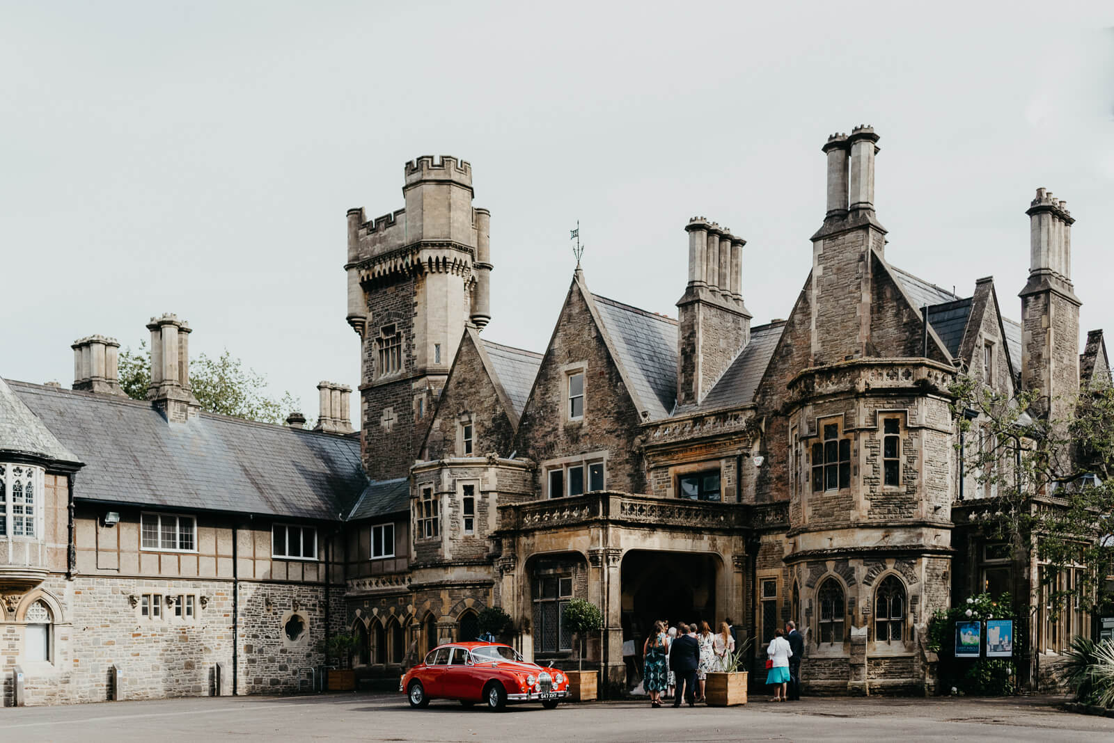Red MKII Jaguar parked outside Insole Court Wedding